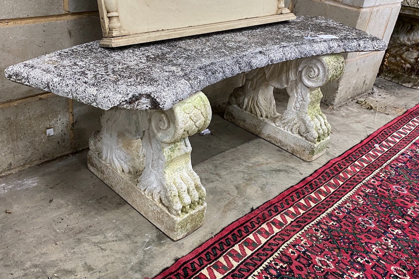 A white painted reconstituted stone curved garden seat, length 132cm, 40cm, height 44cm, Provenance- the late Maureen Marchioness of Dufferin and Ava, Owl House Gardens, Lamberhurst, Kent